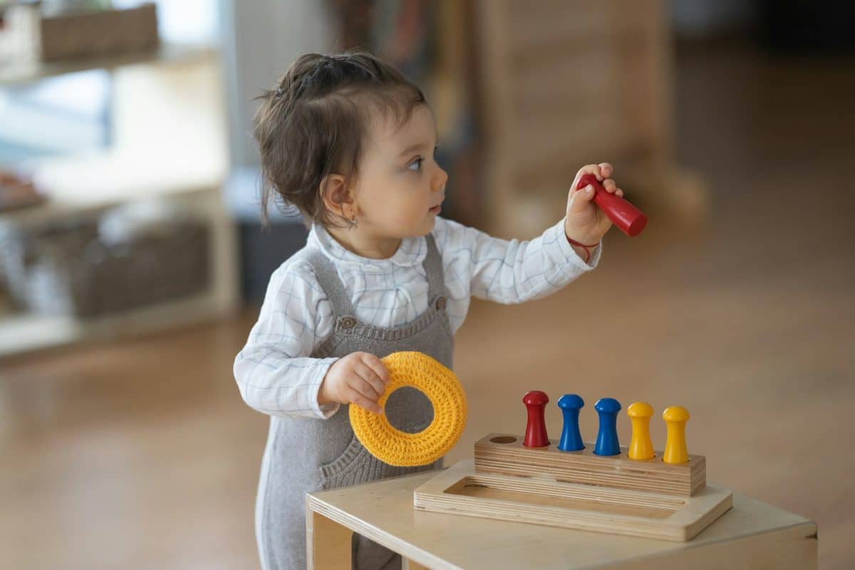a baby playing with toys